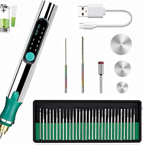 Etchkind engraving kit arranged with its USB cable, bits and cutting accessories